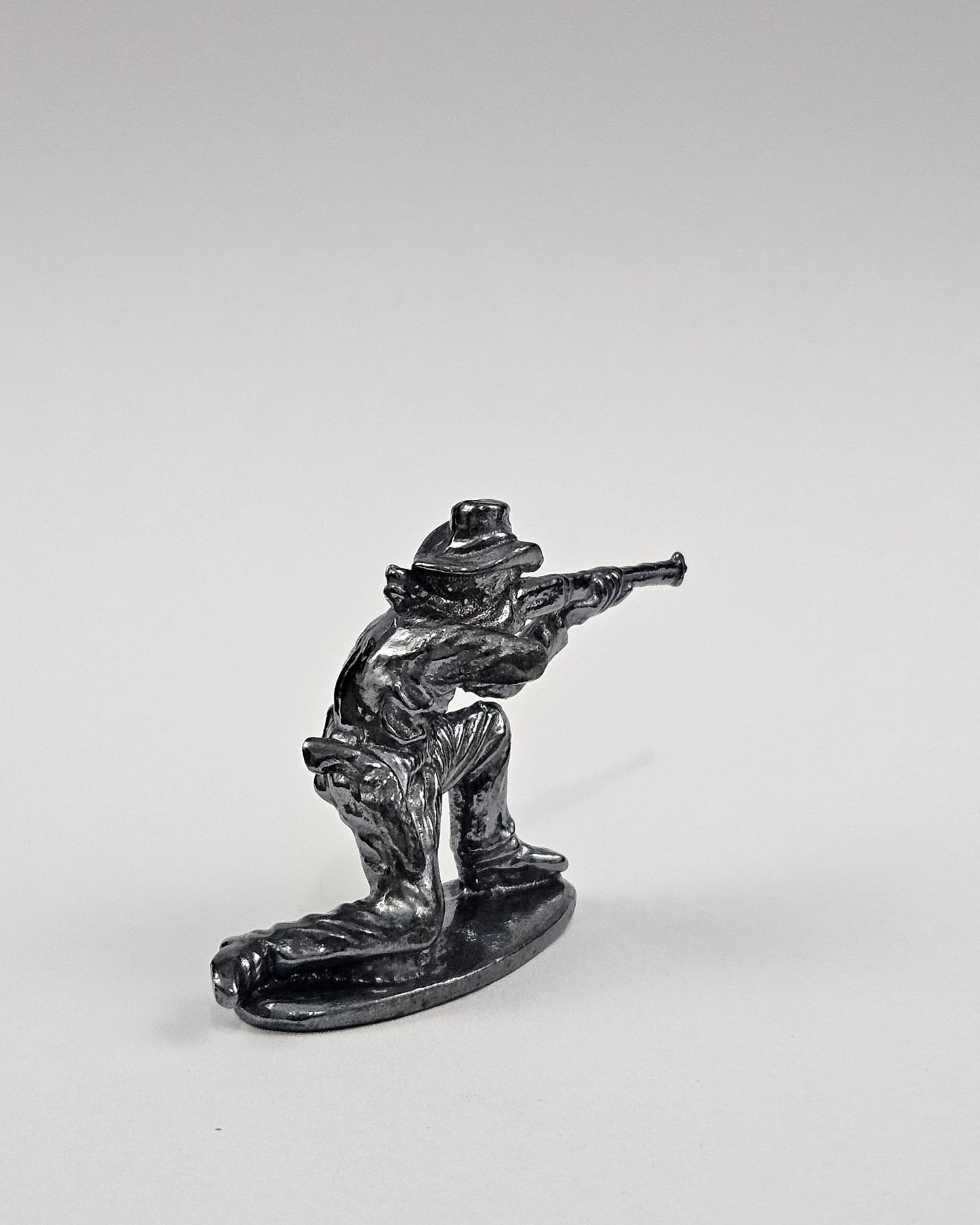 Kneeling Cowboy Hand Cast Bullion .999 Fine Silver Dark Finish